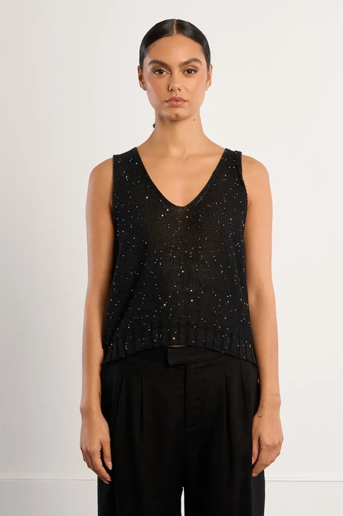 top-de-mujer-de-manga-sisa-con-lunares-brillantes- (2).webp