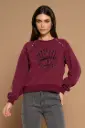Sudadera bordado ojo y tachuelas