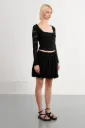 Falda corta con pliegues LILI SIDONIO