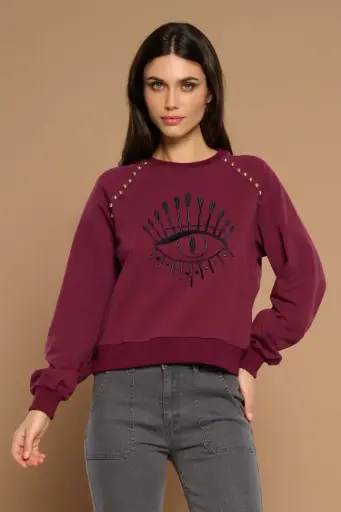 Sudadera bordado ojo y tachuelas